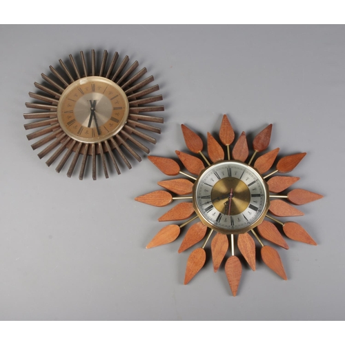 377 - A 1960's teak Anstey and Wilson sunburst clock along with similar West Clox example.