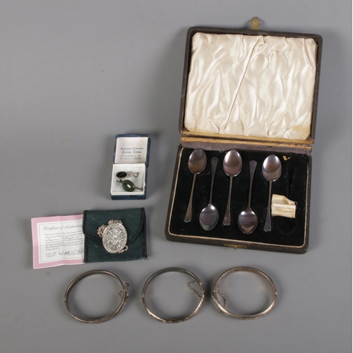 391 - A quantity of silver including three Birmingham silver bangles hallmarked 1969, 1976 and 1977, Frank... 