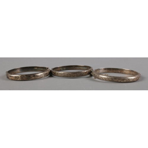 391 - A quantity of silver including three Birmingham silver bangles hallmarked 1969, 1976 and 1977, Frank... 