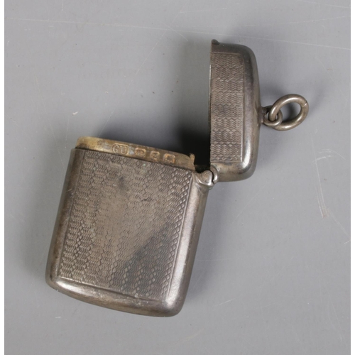 395 - A Victorian silver vesta case, assayed for Birmingham 1899 by George Unite. Monogramed CE to front, ... 