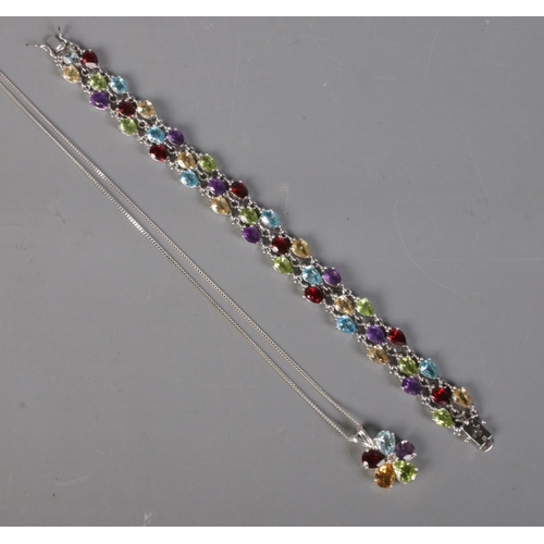 412 - A silver multicoloured stone set bracelet and pendant on chain.