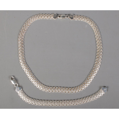 413 - A silver chain and matching bracelet. Marked Milor 925 Italy. 41g.