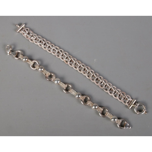 415 - Two silver bracelets. 33g.