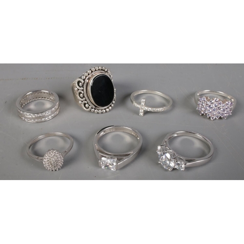 417 - Seven silver rings. Includes cubic zirconia set example, etc.