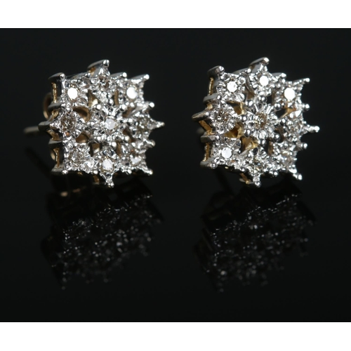 448 - A pair of 9ct gold diamond cluster stud earrings.