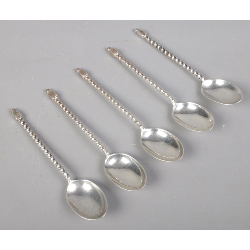 489 - Five silver twisted stem teaspoons. Assayed Sheffield 1939 by Cooper Brothers & Son. 68g.