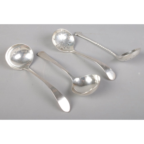 490 - Two silver sugar shifting spoons along with two silver ladles. Various hallmarks and makers. Include... 