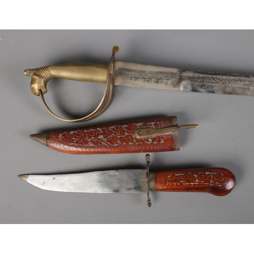 499 - A 20th century Indian dress sword with scabbard along with similar knife example. CANNOT POST OVERSE... 