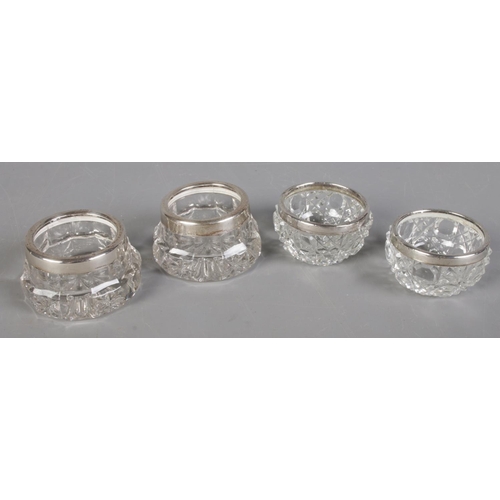 501 - Two pairs of cut glass silver rimmed salts.