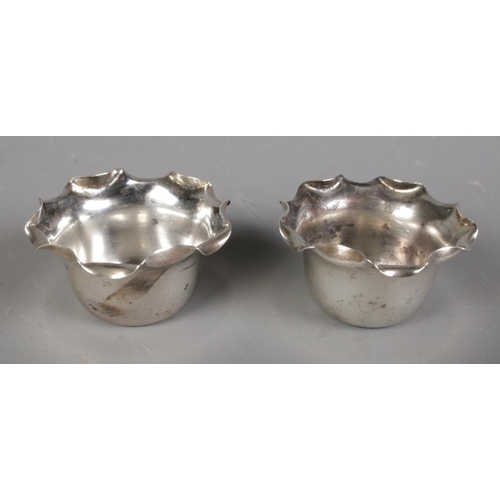 502 - A pair of Victorian scalloped silver salts. Assayed Birmingham 1891 by A & J Zimmerman Ltd, 18g.