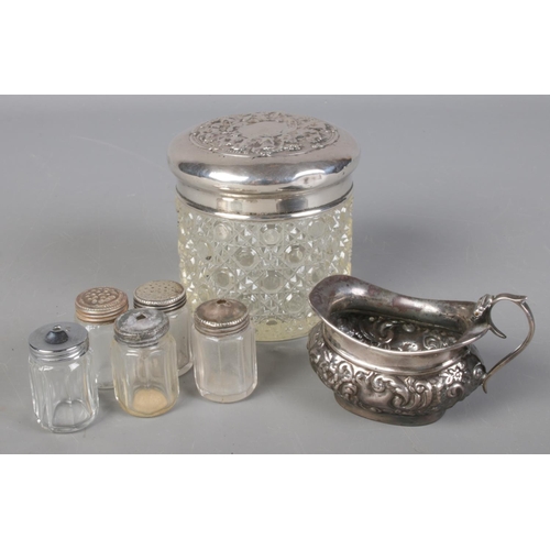 509 - A quantity of silver and white metal. Including small silver jug, white metal topped glass jar, silv... 