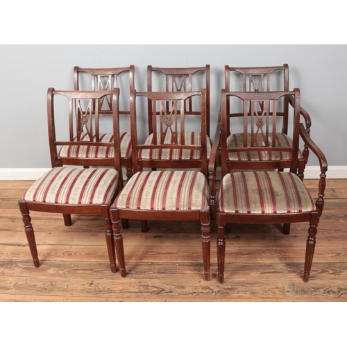 539 - Six upholstered dining chairs including two carver style along with hardwood dining table.