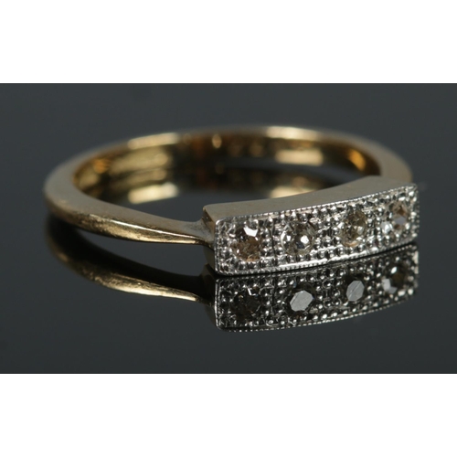 468 - An 18ct Gold and Platinum four stone Diamond ring, in illusion set border. Size J. Total weight: 2.4... 