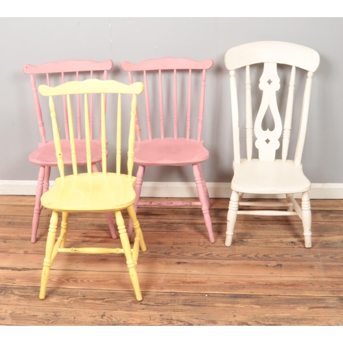 535 - Four painted wooden chairs including three kitchen examples painted in pink and yellow.