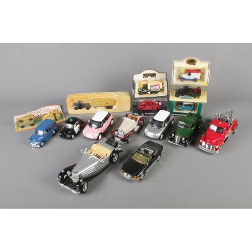 263 - A quantity of diecast vehicles including 1:24 and 1:26 scale. Also includes boxed examples such as C... 