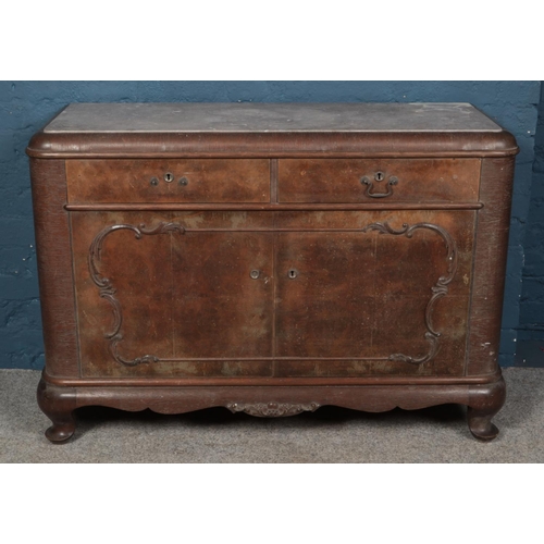 634 - A carved walnut Biedermeier style sideboard with marble top. (85cm x 123cm x 46cm)