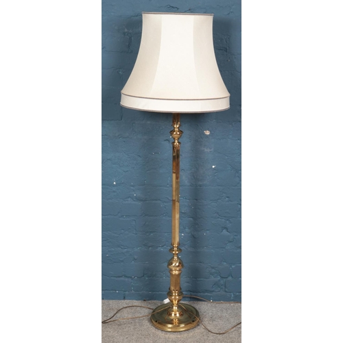 618 - A gilt metal standard lamp.