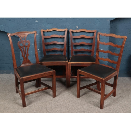 620 - Four Georgian elm dining chairs.