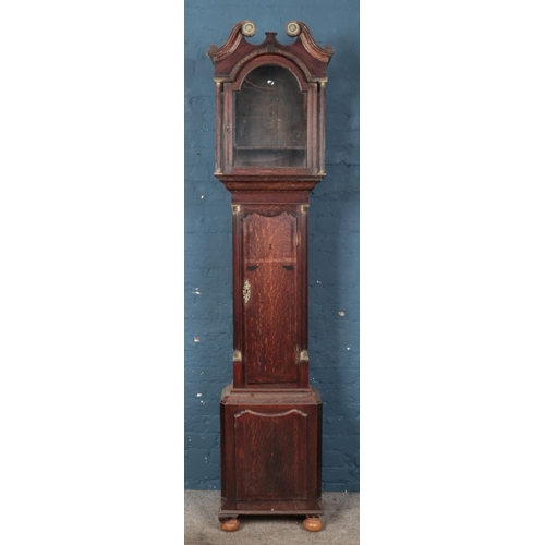 628 - A Georgian oak longcase clock case, with double swan neck pediment and gilt highlights. 228cm high. ... 