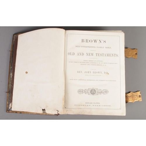 106 - A Brown's leather bound family bible. By Rev. John Brown. Published by Edward Slater, Cononley, near... 