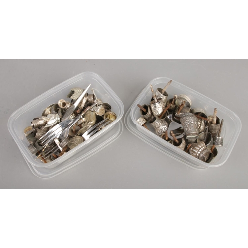 123 - Two small boxes of silver and white metal cutlery mounts and collars.