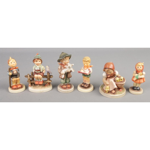 144 - Six Goebel figures. Includes 'Little Hiker', 'Honor Student', etc.