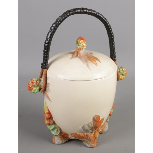 149 - A Newport Pottery Clarice Cliff lidded barrel. With swing handle. (20cm)