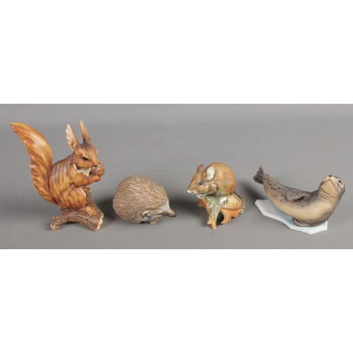 151 - Four ceramic Kaiser animals. Including hedgehog, seal, squirrel and rat.