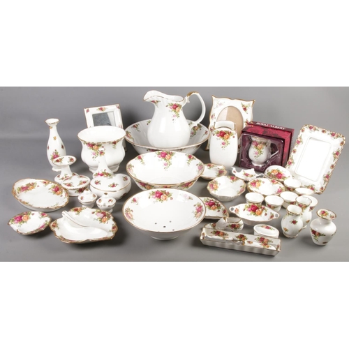 161 - A quantity of Royal Albert Old Country Roses ceramics. Including wash jug & bowl, photo frames, vase... 
