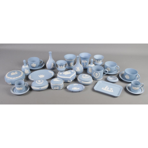 164 - A large quantity of Wedgwood jasperware. Includes vases, boxes, cups and saucers etc.