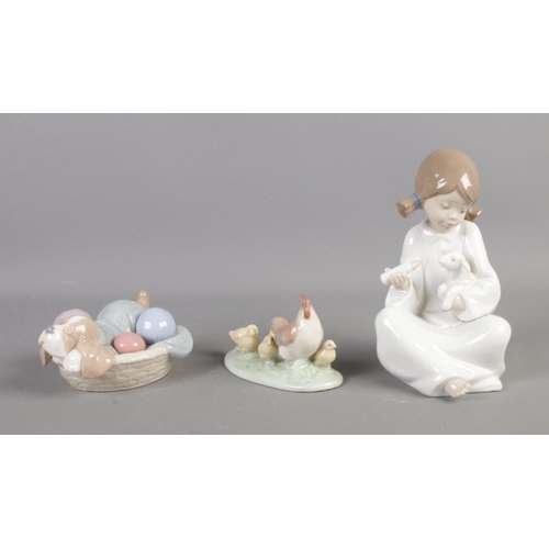 165 - Three boxed Nao by Lladro figures to include 01275: Tomatelo Todo, 01406: Dozing Doggy and 01047: Ga... 