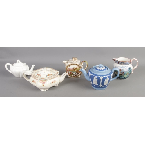 168 - A collection of ceramic teapots and jugs, including Royal Doulton Geneva, Dudson Bros. and W.H Grind... 
