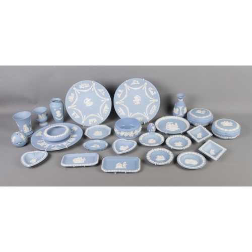 26 - A collection of Wedgwood blue jasperware to include plates, trinket boxes, vases, etc.