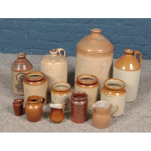 250 - A box of stoneware. Includes large flagons, jars and jugs etc.