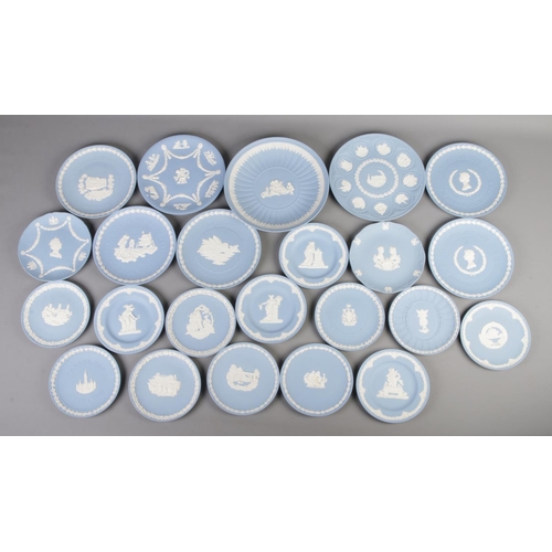 299 - A collection of Wedgwood blue jasperware display plates, to include Sydney Opera House, Queen Elizab... 