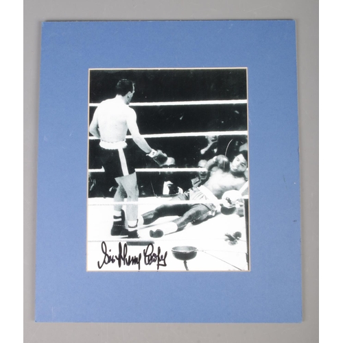42 - Sir Henry Cooper; a signed monochrome photograph showing the knockout against Muhammad Ali. Signed f... 