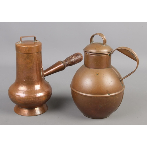 53 - A Martins of Guernsey copper cream jug along with a similar hammered copper vessel.