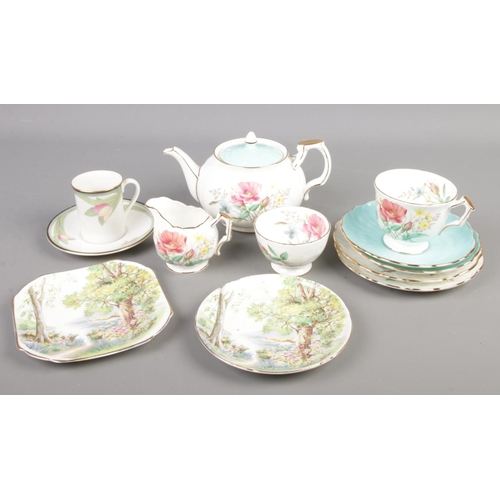 55 - A collection of bone china teawares. Includes Aynsley, Shelley Woodland pattern and Royal Doulton Aw... 
