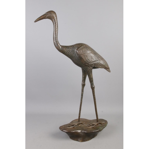 56 - A bronze figure of a crane. 64cm high.