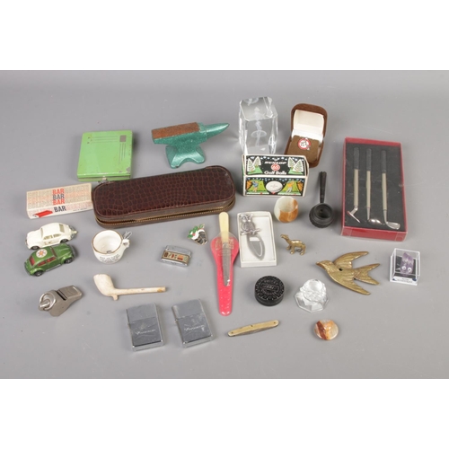 69 - A quantity of collectables to include brass figures, Dunlop Golf Balls, Rolls Razor, etc.