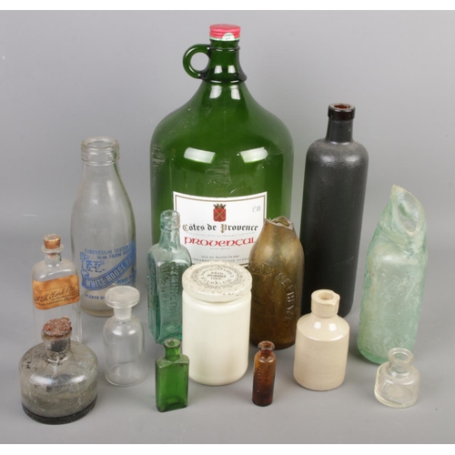 70 - A collection of mostly old glass bottles. Including A.M.Clark Ltd, White House Farm, Symington & Co,... 