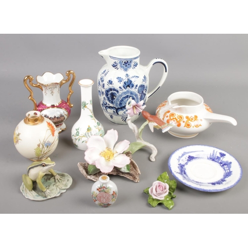71 - A quantity of ceramics. Including Limoges vase, Royal Worcester, Delft jug, Kaiser, Oriental scent b... 