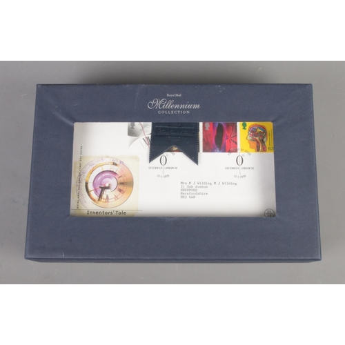 77 - A boxed Royal Mail Millennium Collection of first day covers along with an album British stamps of m... 