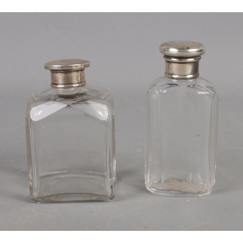 574 - Two silver topped scent bottles. Tests as silver.