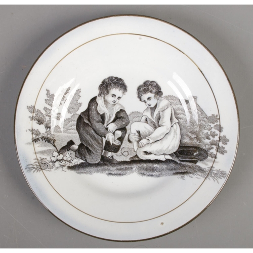 580 - A small nineteenth century Don Pottery plate; black printed depicting children. 'C-shaped' crescent ... 