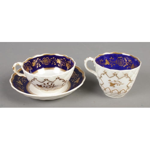 581 - Three pieces of Rockingham porcelain of similar design, comprising of a cup and saucer and smaller c... 