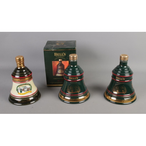 94 - Three sealed and full Bell's Whiskey Christmas bell decanters including 1990 and 2 x 1992.