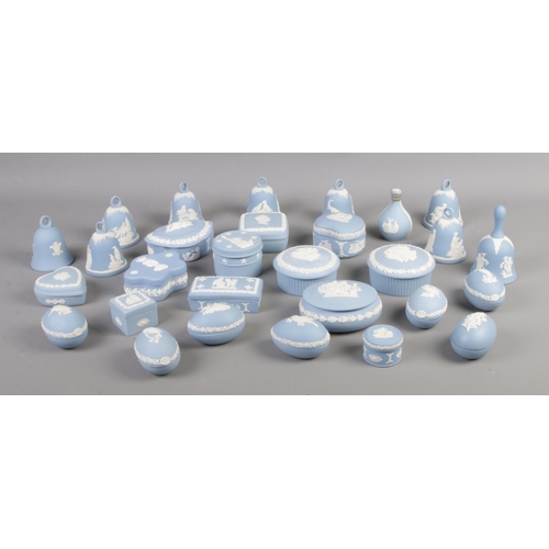 98 - A large quantity of Wedgwood jasperware in sky blue, to include lidded trinket boxes, bells and eggs... 