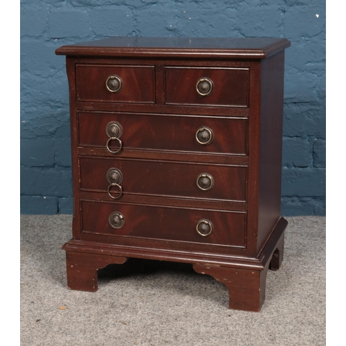 587 - A mahogany two over three apprentice chest. Approx. dimensions 43cm x 30cm x 52cm.