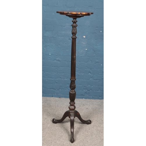 592 - A Victorian tall standing carved mahogany jardiniere stand. On tripod base with ball and claw feet. ... 